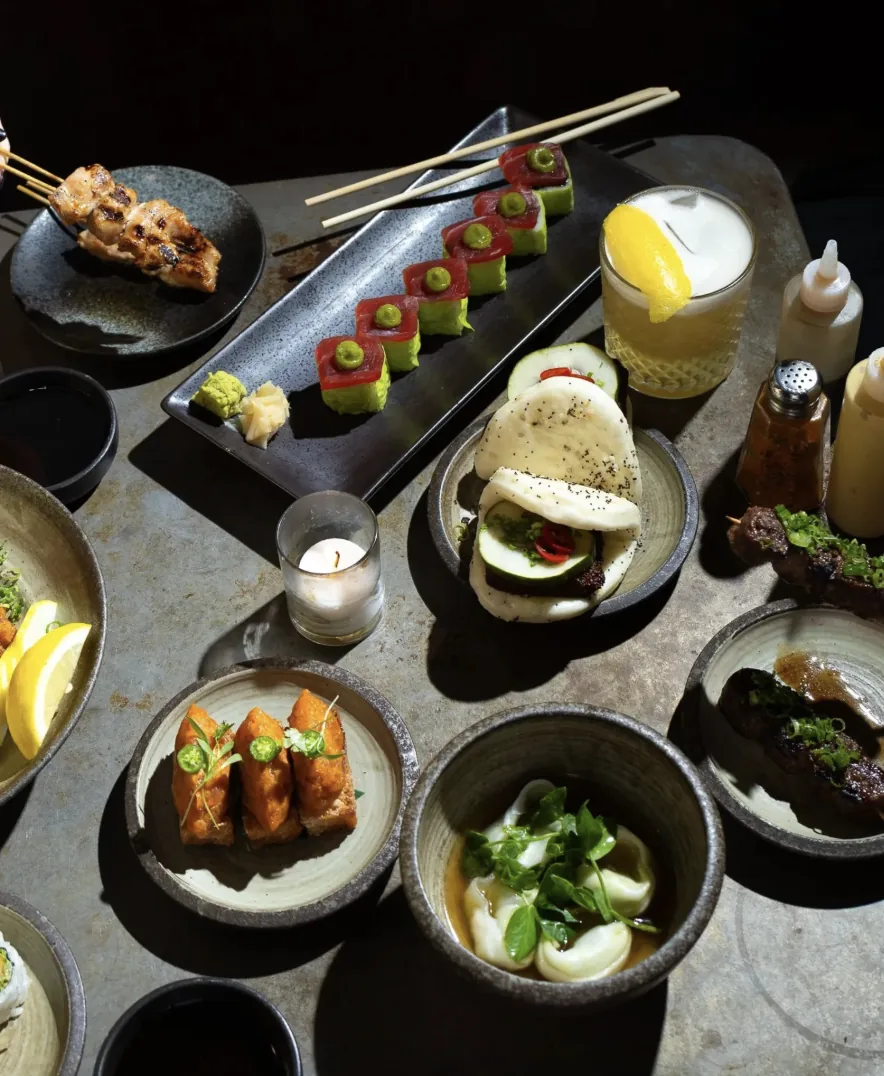 A spread of GUSI dishes — dumplings, skewers, and small plates blending Eastern European tradition with Mediterranean influence