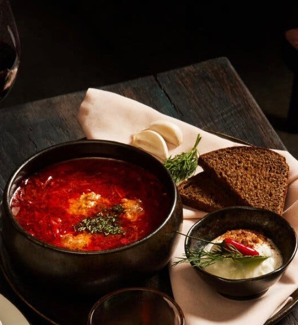 Borscht at GUSI — beet soup with a dollop of sour cream, served with garlic, dill, and dark rye bread
