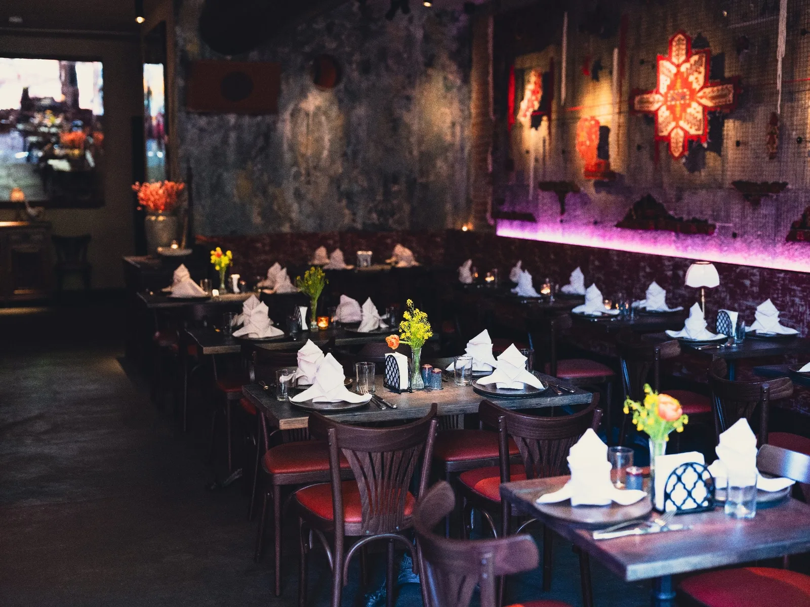GUSI first-floor dining room — tables set with warm lighting in a modern Eastern European restaurant in Greenwich Village