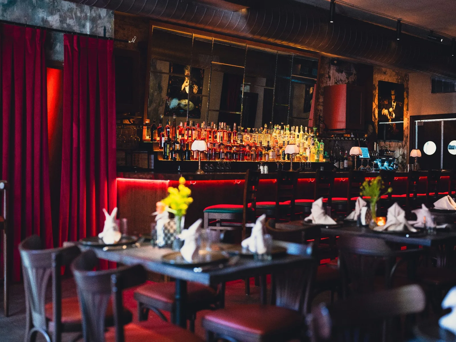 GUSI first-floor tavern bar in Greenwich Village — long counter and bottle display in a warmly lit Eastern European restaurant