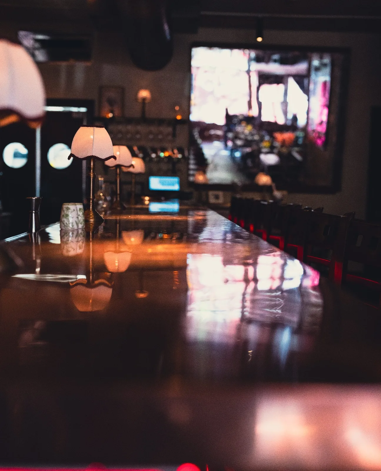 Vertical view of GUSI's first-floor interior — candlelit Eastern European bar and dining space at 432 Sixth Avenue, NYC